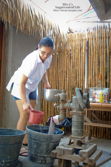 Getting water to cook rice.