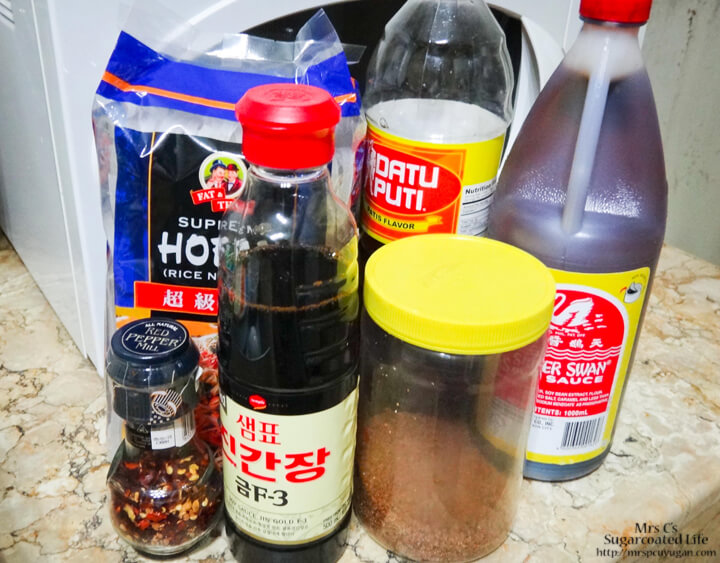 Clockwise from bottom left: Pepper Flakes, Rice Noodles, Fish Sauce, Soy Sauce, Brown Sugar, Sweet Soy