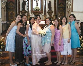 Hiding our bellies behind her bridal bouquet. She was about 9 months pregnant, and I was 7 months along.
