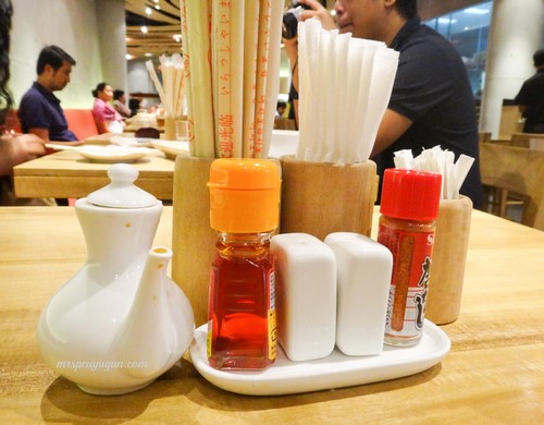 Condiments on the table. I am so addicted to that Japanese chili powder!