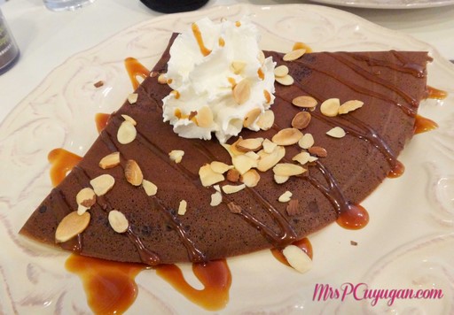 Mango Hazelnut au Chocolat Chocolate crepe, fresh mangoes, Nutella, salted butter caramel, sliced almonds and whipped cream.